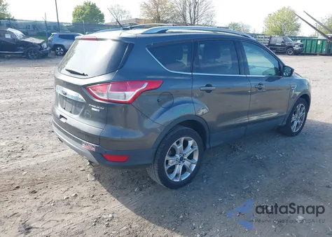 2016 Ford Escape Titanium z USA, uszkodzony, nr VIN 1FMCU9J95GUB85602